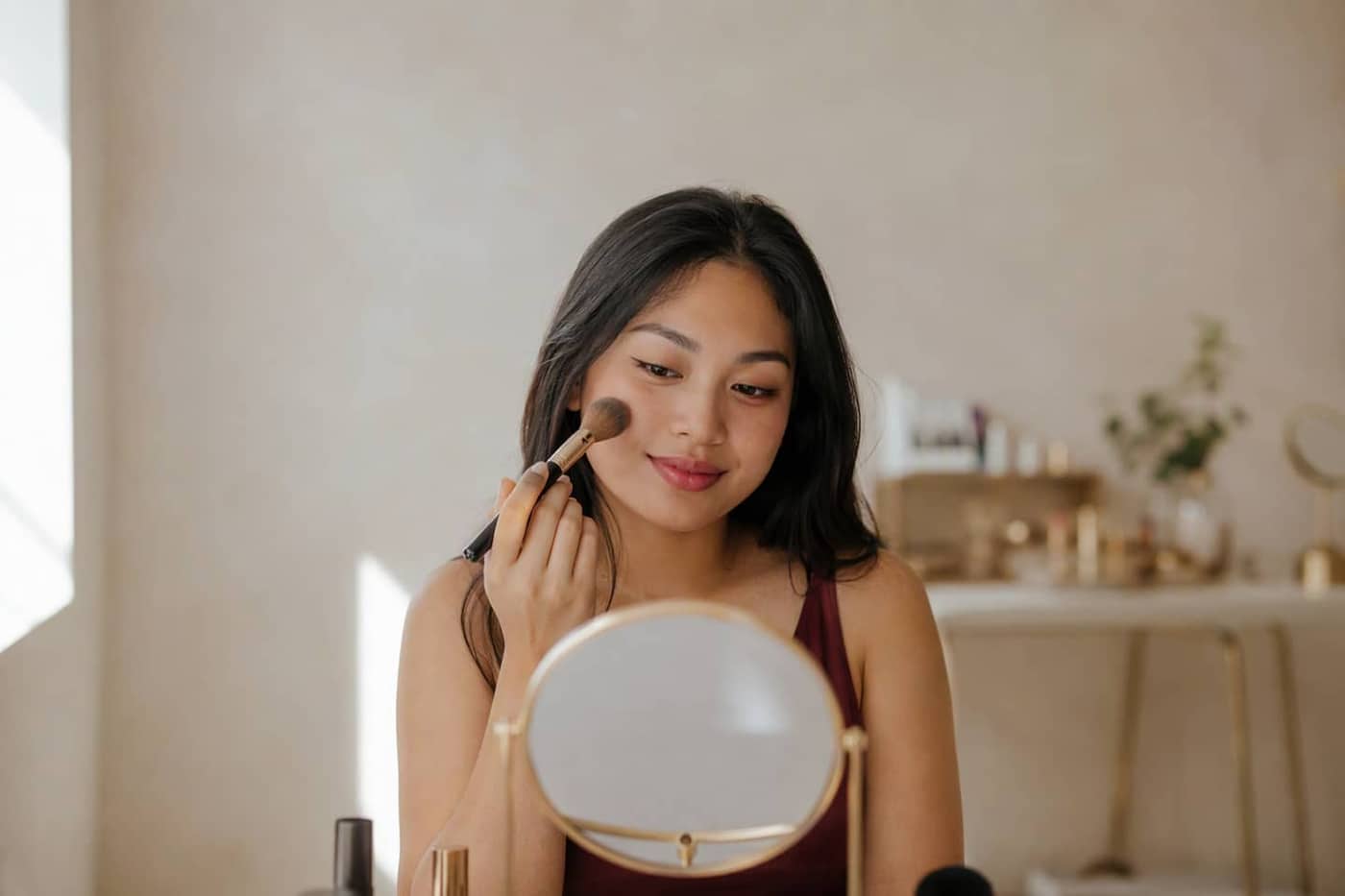 Model with a clean, no-makeup makeup look applied in class